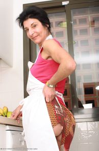 Dark Hair Older Lady Teasing In The Kitchen